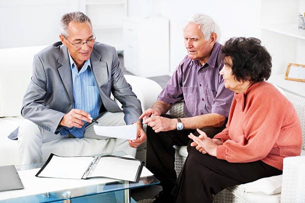 Mature couple talking to lawyer
